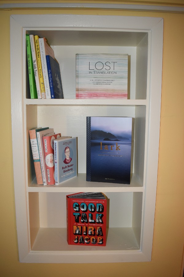 Therapeutic book collection in wall shelves