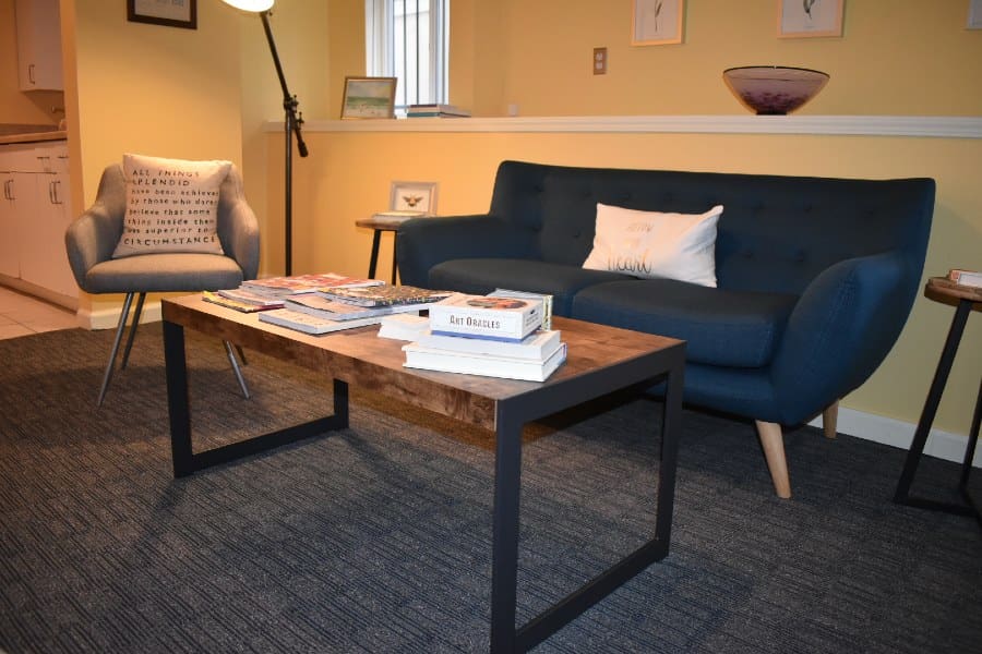 Lisa Kothari's Seattle therapy practice, cozy with yellow walls and comfy couch